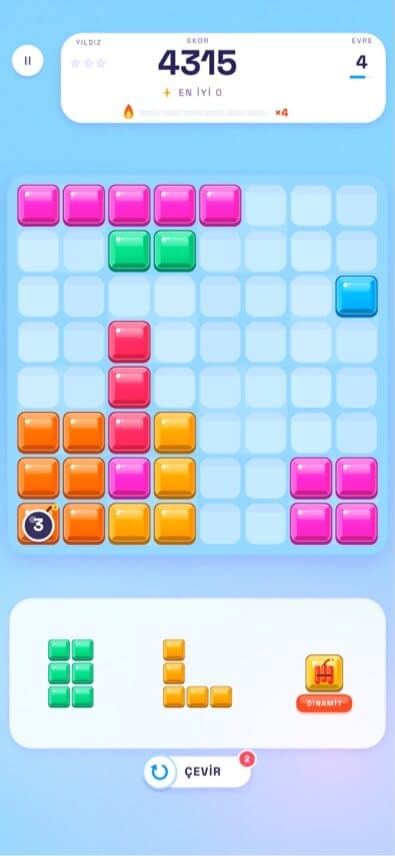 BLOK gameplay: a block puzzle grid with coloured tetromino pieces and three pieces waiting in the tray