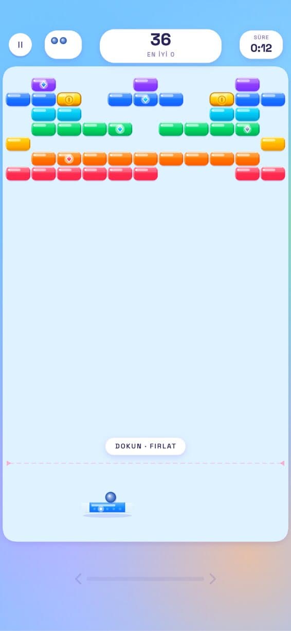 TUGLA gameplay: a brick breaker with rows of coloured bricks at the top and a paddle and ball below